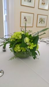 Centrepiece with green flowers as hydrangea, Dendrobiums and Hypericums